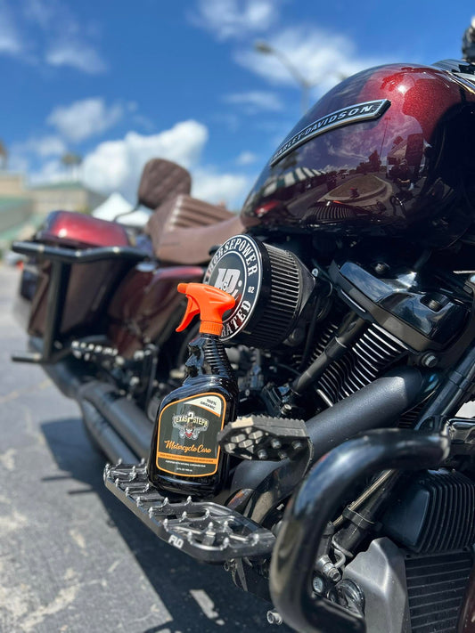 Texas 2 Step Motorcycle Care spray being used to clean a motorcycle without a hose