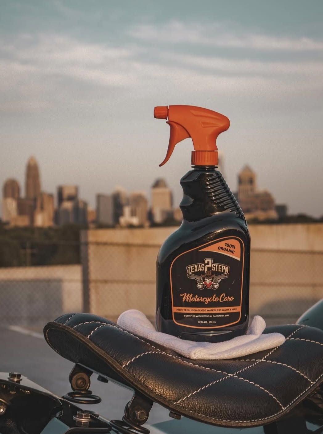 a bottle of bike cleaner with a city view